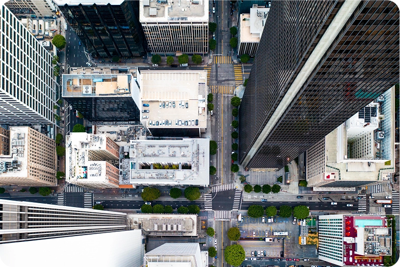 Aerial view of downtown Los Angeles, California, showing high-rise buildings, streets, and parked cars—illustrating the urban environment served by Facility Experts across various industries.